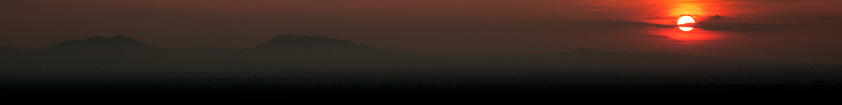 Misty reddish mountain landscape on a sunset.